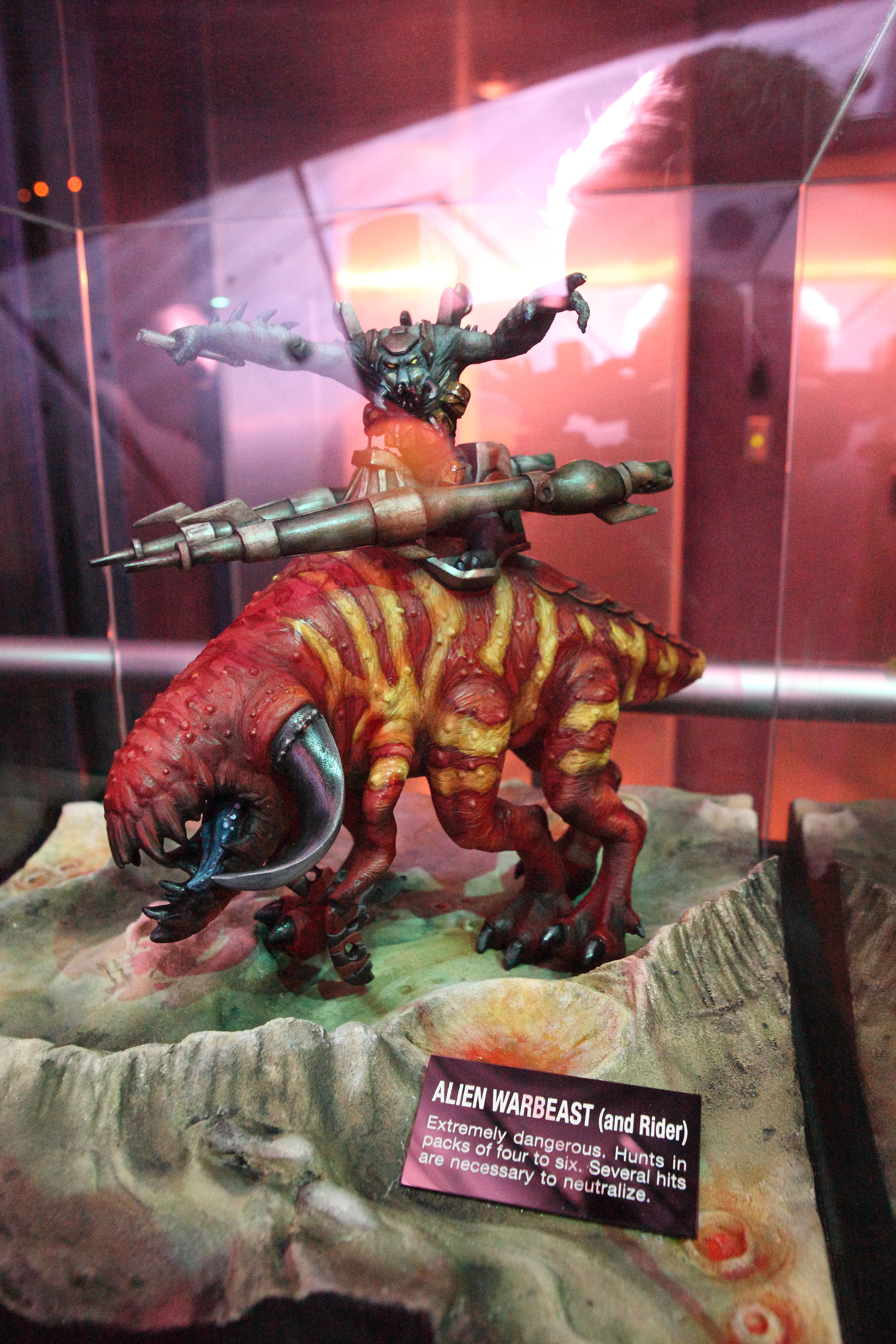 Model of an alien warbeast and rider in Invasion queue