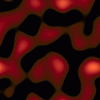 A pattern of blobby red shapes with soft orange highlights on a black background